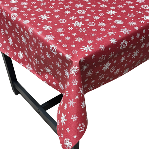 Red snowflake Christmas vinyl tablecloth – festive waterproof PVC table cover with wipe-clean surface and winter holiday design