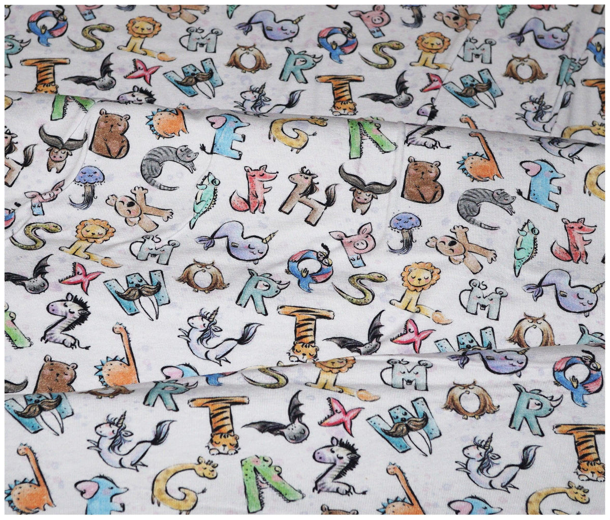 Alphabet Animal Printed Jersey - The Fabric Trade